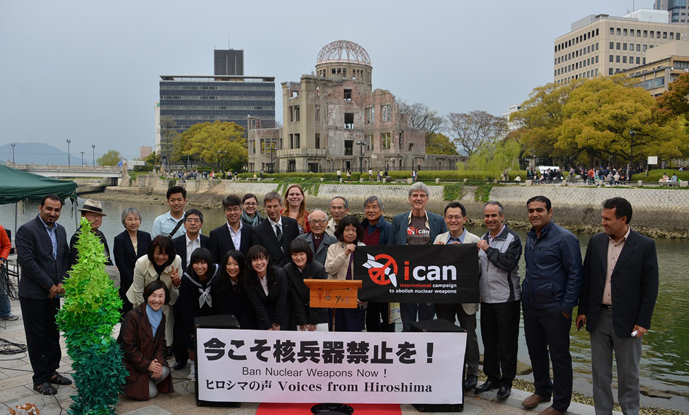 Members and colleagues of the Japan NGO Network for Nuclear Weapons Abolition  in front of the Atomic Bomb Dome in Hiroshima